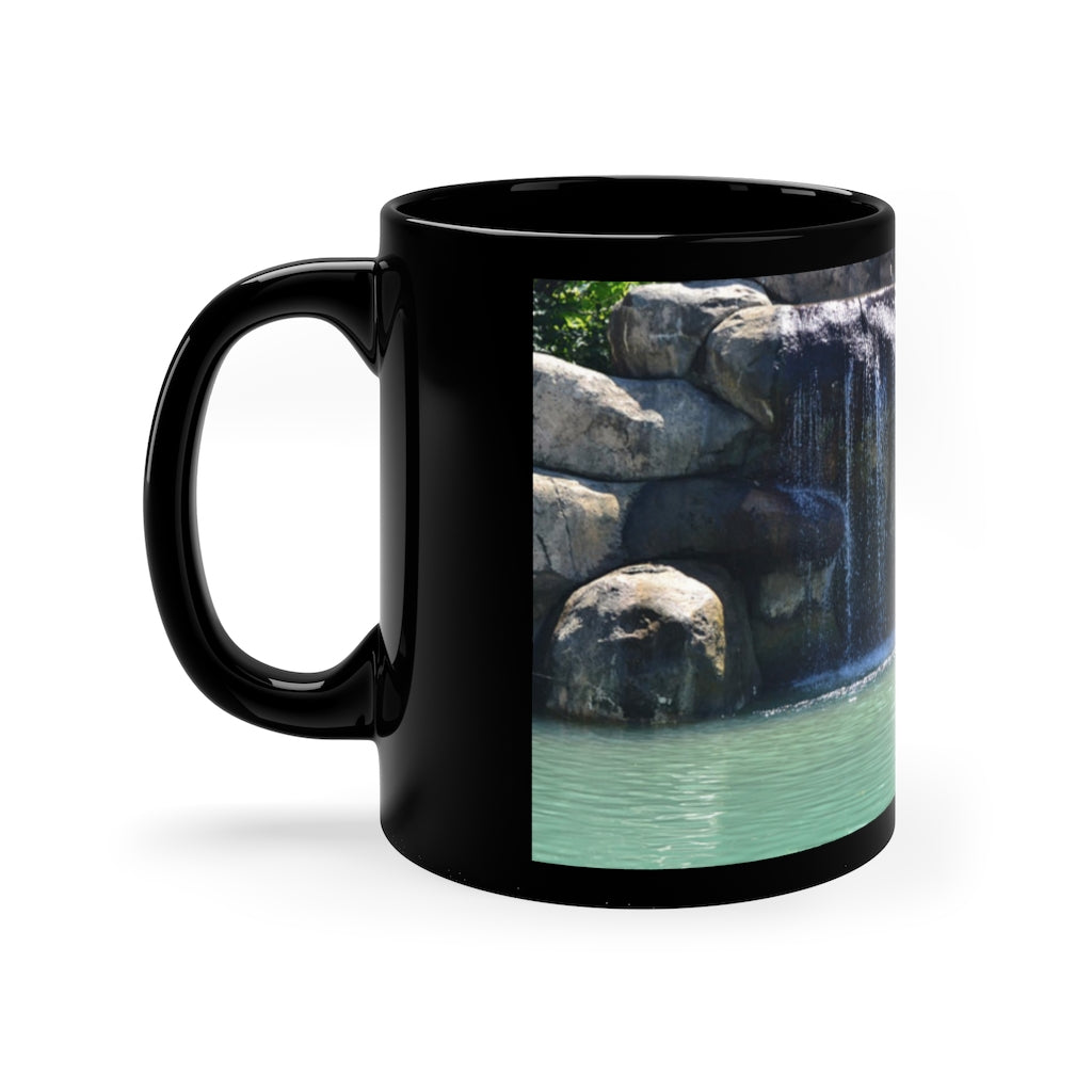 Rock Waterfall 11oz Black Mug with a sleek design, perfect for coffee, tea, or hot chocolate, featuring a customizable surface.