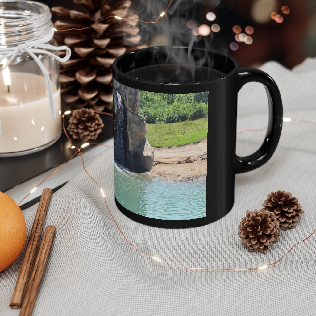 Rock Waterfall 11oz Black Mug with a sleek design, perfect for coffee, tea, or hot chocolate, featuring a customizable surface.