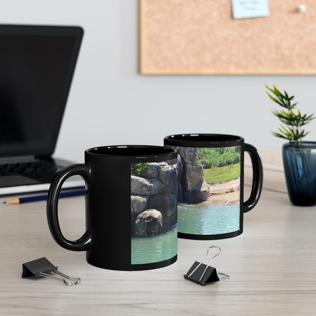 Rock Waterfall 11oz Black Mug with a sleek design, perfect for coffee, tea, or hot chocolate, featuring a customizable surface.