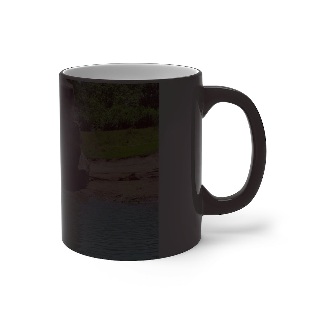 A white ceramic mug featuring a rock waterfall design that changes color when filled with hot liquid, available in 11oz and 15oz sizes.