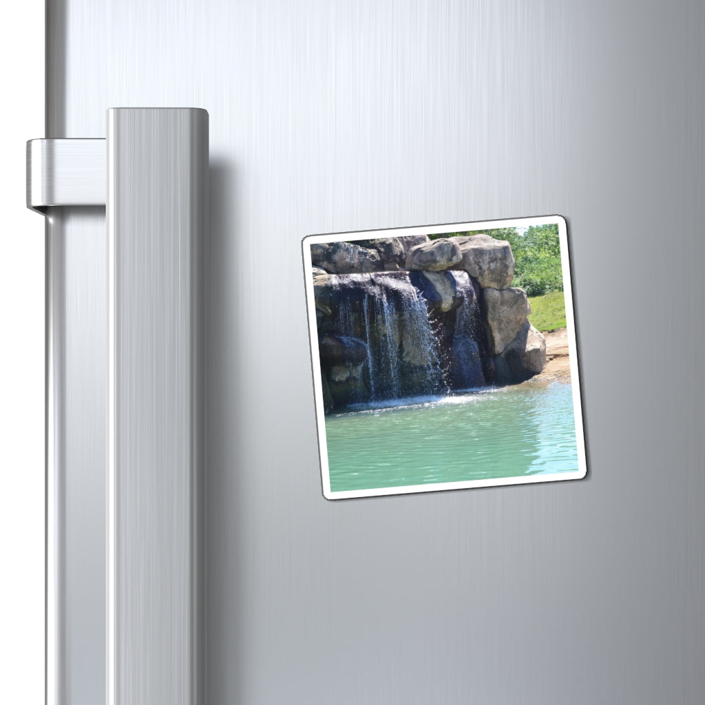 A set of Rock Waterfall Magnets showcasing various sizes and a sleek black backing, ideal for displaying messages on metallic surfaces.