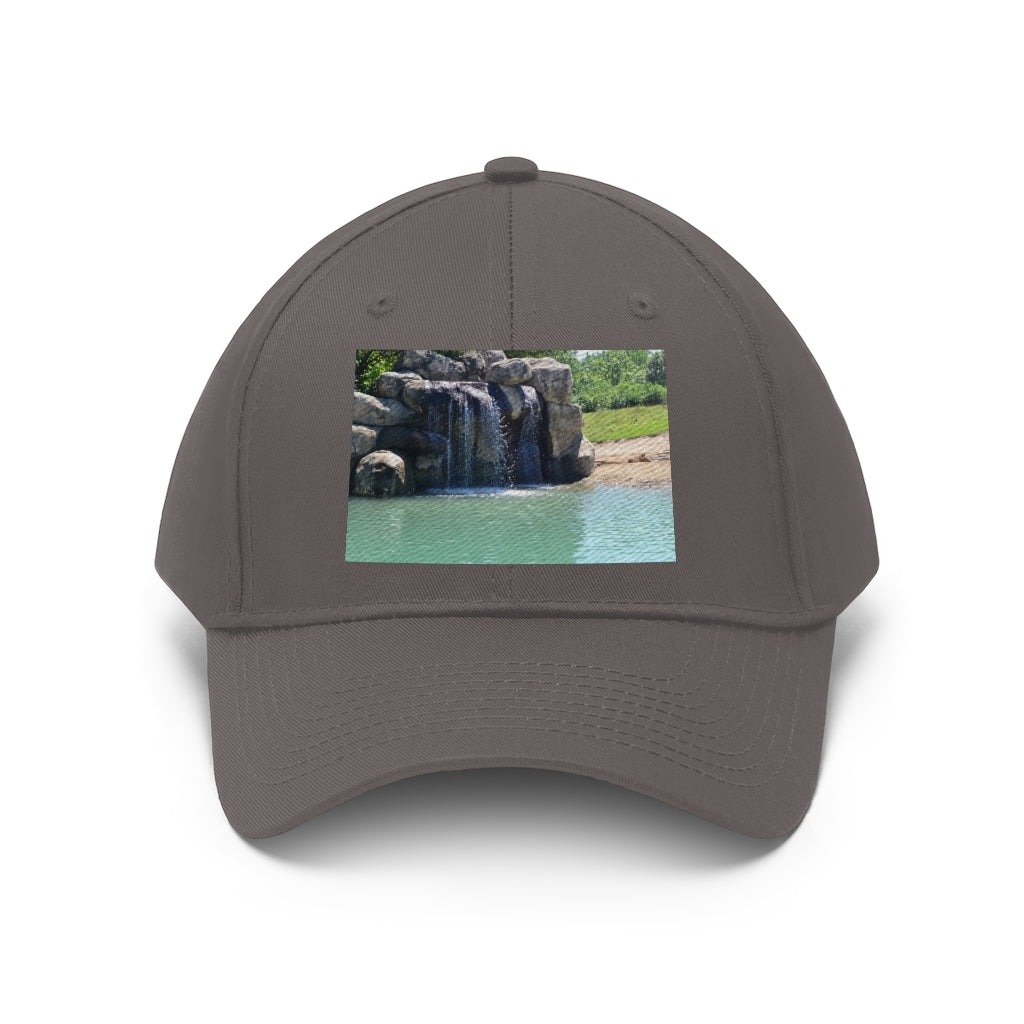 Rock Waterfall Unisex Twill Hat in cotton twill fabric, featuring a classic 6-panel design and adjustable Velcro closure.