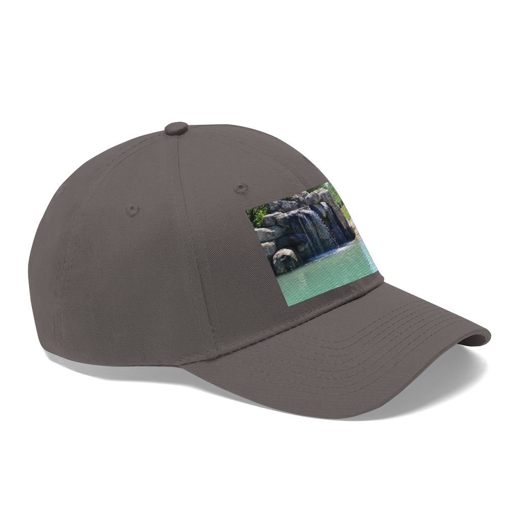 Rock Waterfall Unisex Twill Hat in cotton twill fabric, featuring a classic 6-panel design and adjustable Velcro closure.