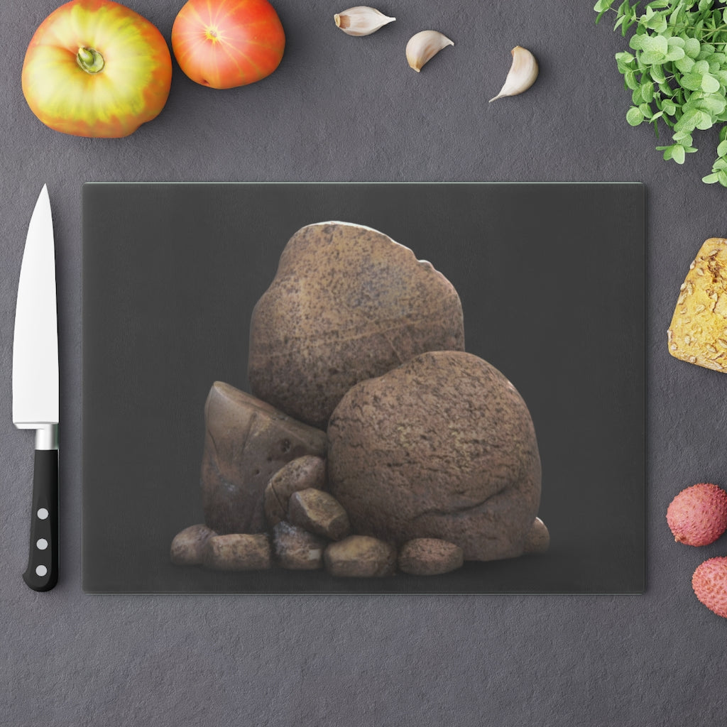 Rocks Cutting Board made of tempered glass with rubber dots for stability, showcasing a stylish design.