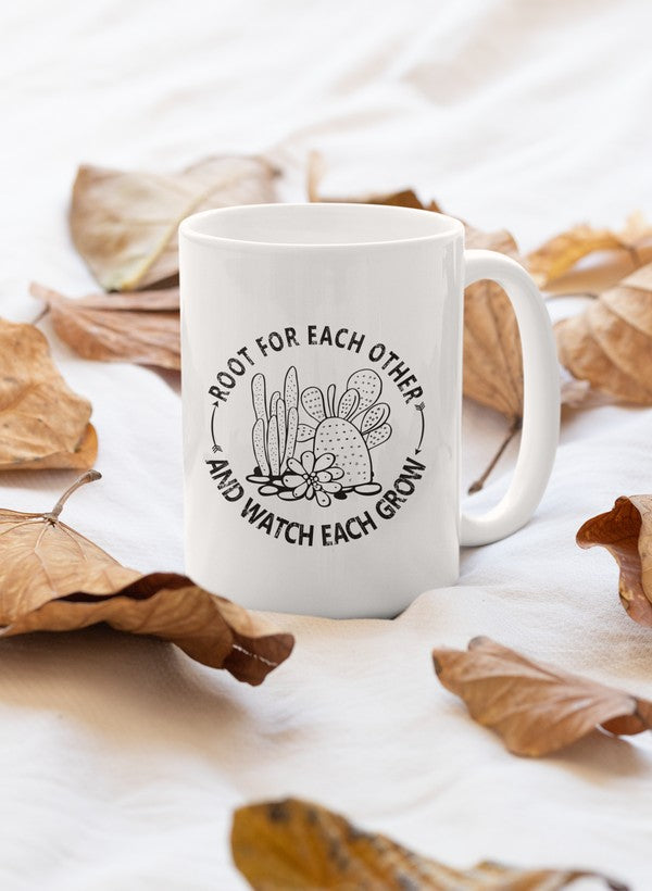 A stylish 11oz ceramic mug with a glossy finish, featuring the phrase 'Root For Each Other' and a sturdy handle, perfect for coffee or tea.