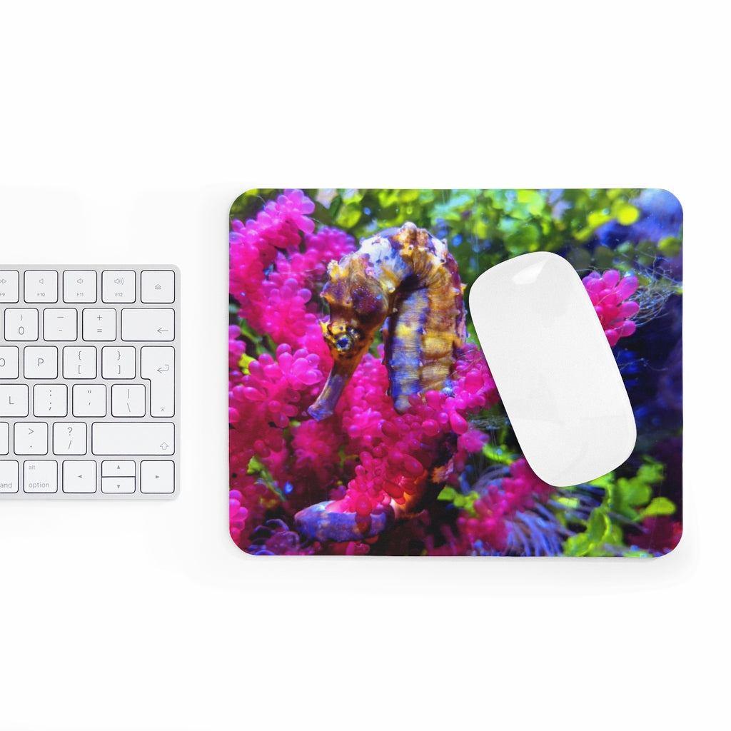 A colorful seahorse mouse pad featuring a vibrant design on a smooth neoprene surface, ideal for enhancing any desk.