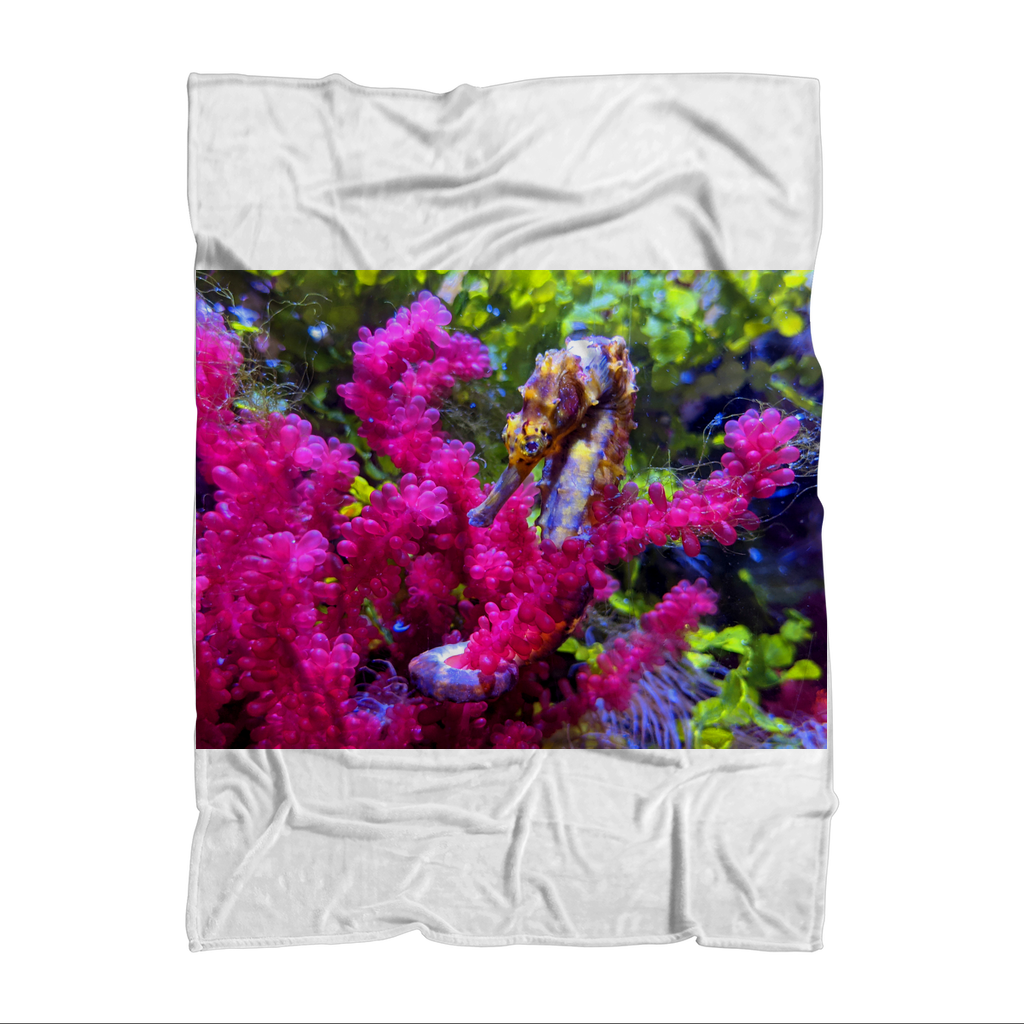 Seahorse Sublimation Throw Blanket featuring vibrant colors and soft polar fleece fabric, ideal for cozying up.