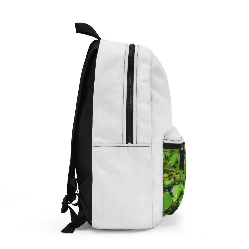 Seeds and Green Leaves Backpack made from durable spun polyester, featuring adjustable straps and a custom name tag.