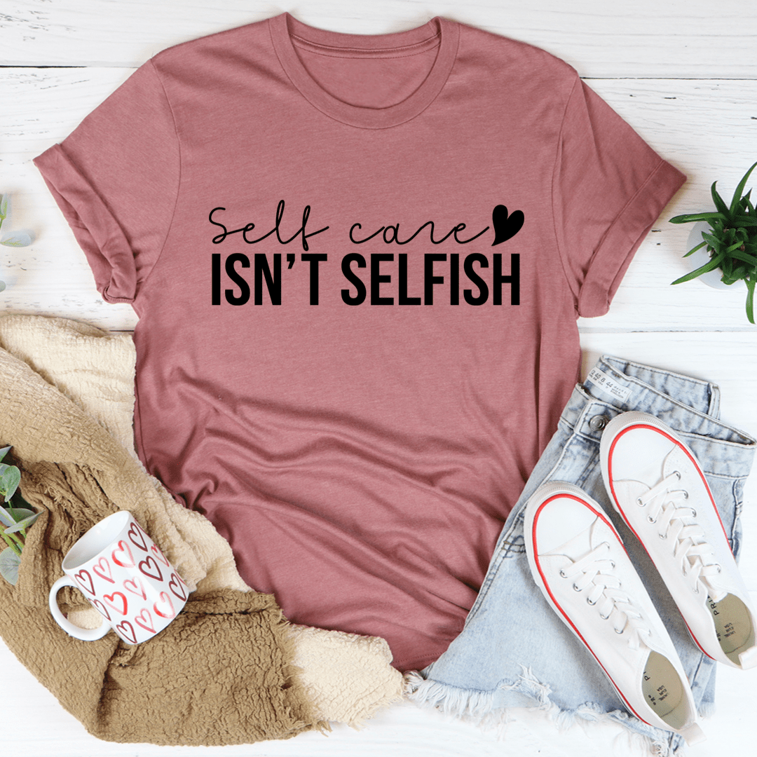 A comfortable and stylish 'Self Care Isn't Selfish' T-Shirt made from soft ring-spun cotton, featuring a durable design and a positive message.