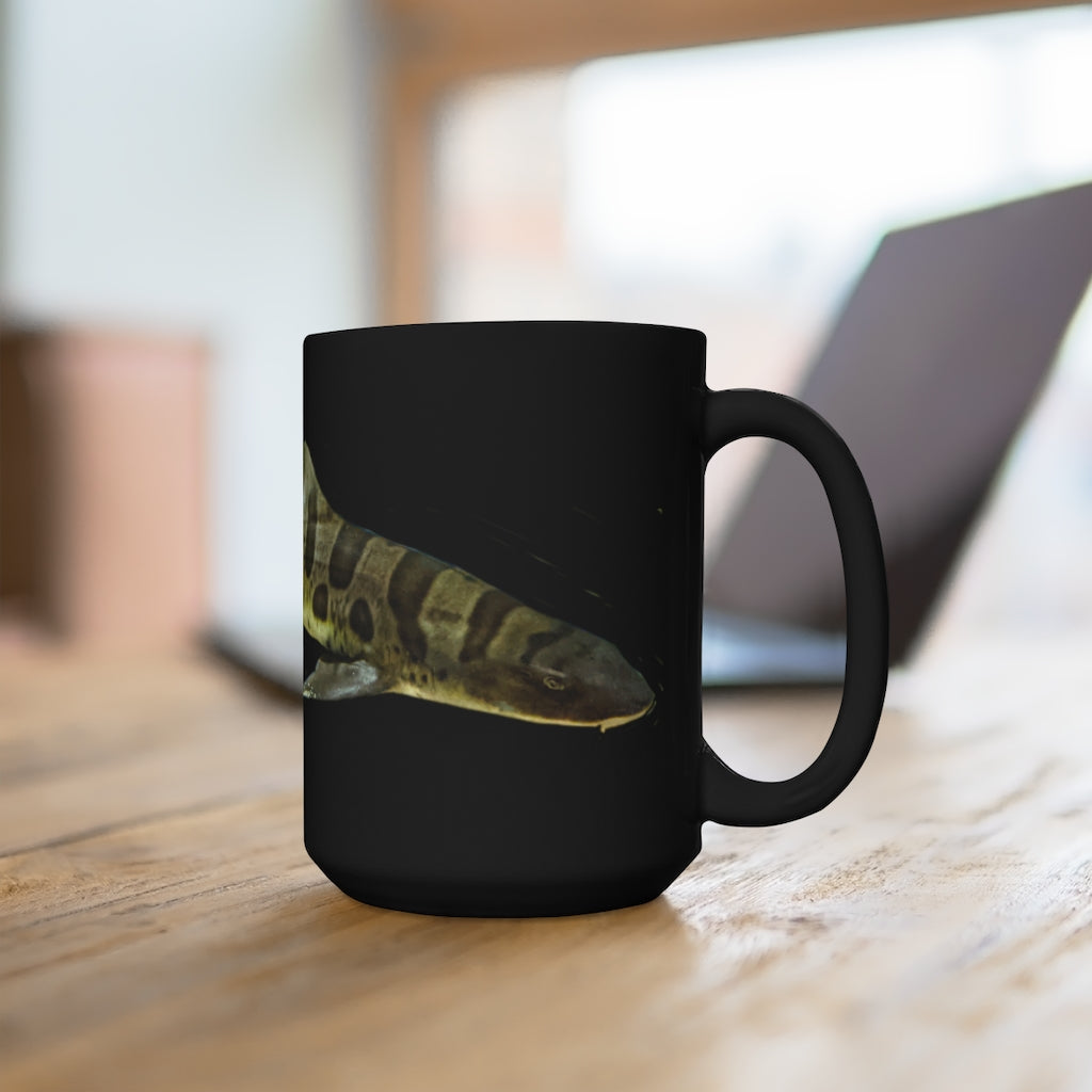 Shark Black Mug 15oz featuring a sleek black ceramic design with a comfortable C-handle, ideal for coffee and tea lovers.