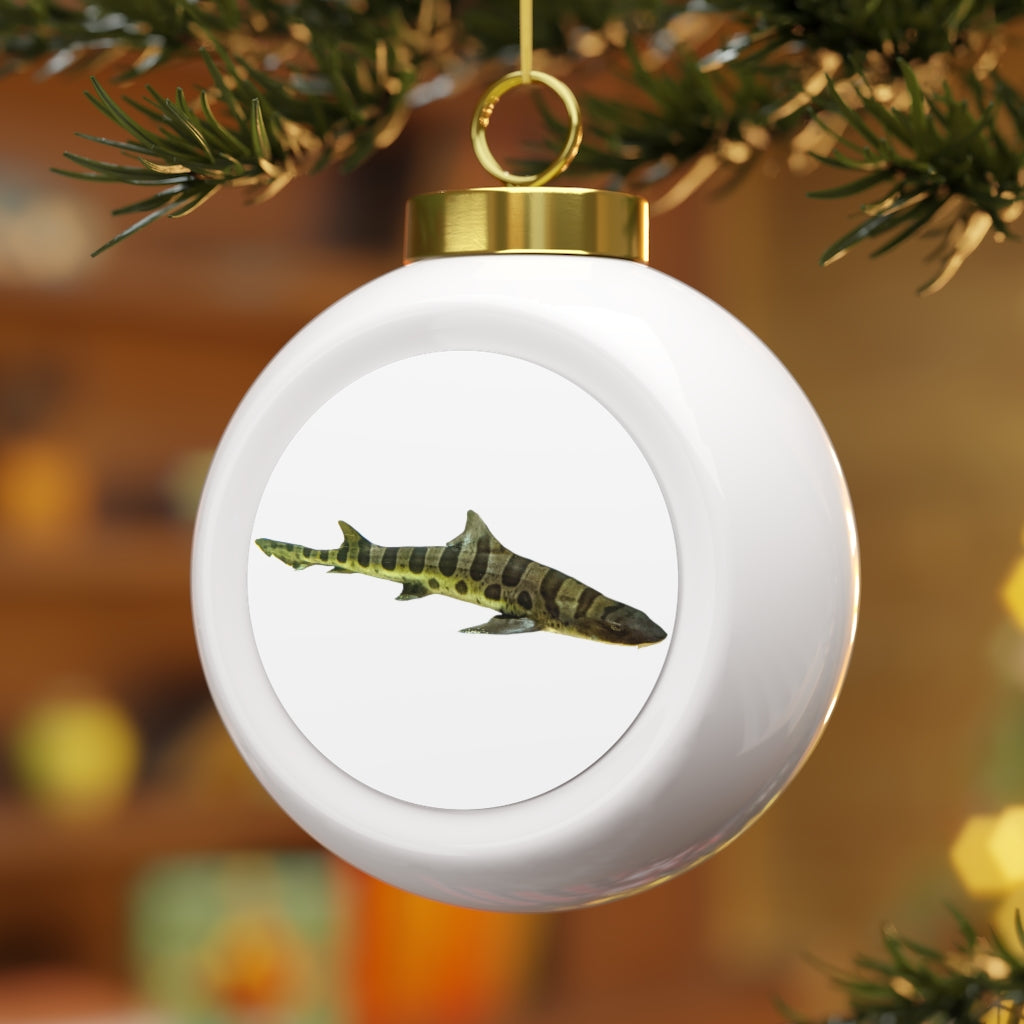 A beautifully designed Shark Christmas Ball Ornament featuring a glossy finish and a gold ribbon for hanging, perfect for holiday decor.