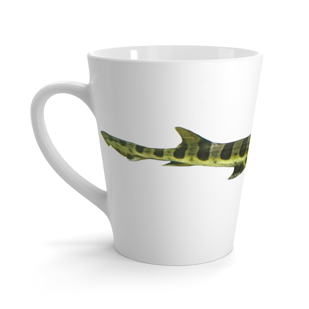 A stylish white ceramic latte mug featuring a vibrant shark design, perfect for coffee lovers.