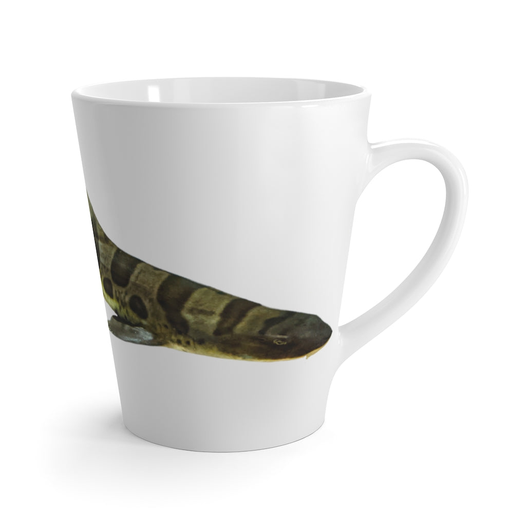 A stylish white ceramic latte mug featuring a vibrant shark design, perfect for coffee lovers.