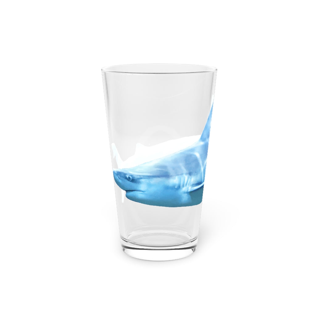 A clear 16oz Shark Pint Glass showcasing a customizable design, perfect for beverages.