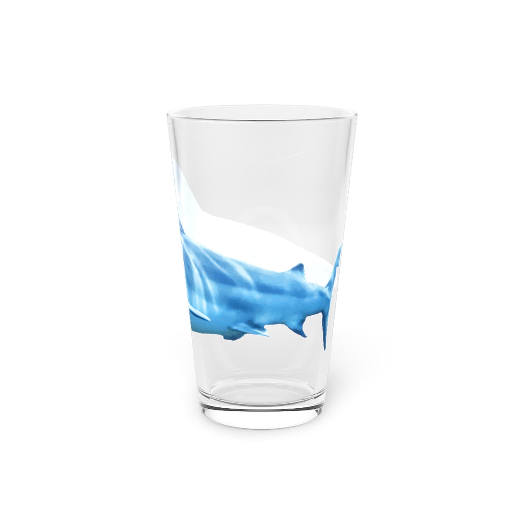 A clear 16oz Shark Pint Glass showcasing a customizable design, perfect for beverages.