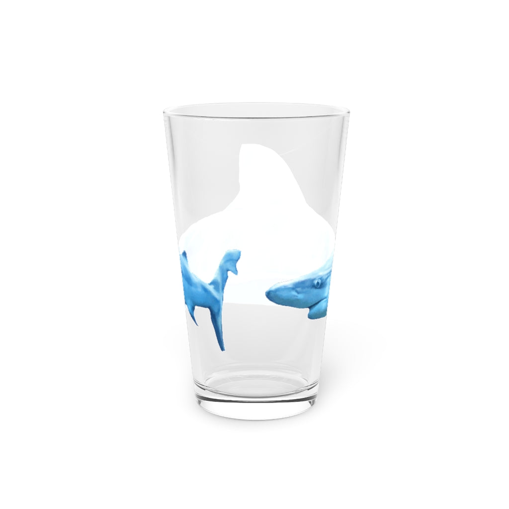 A clear 16oz Shark Pint Glass showcasing a customizable design, perfect for beverages.