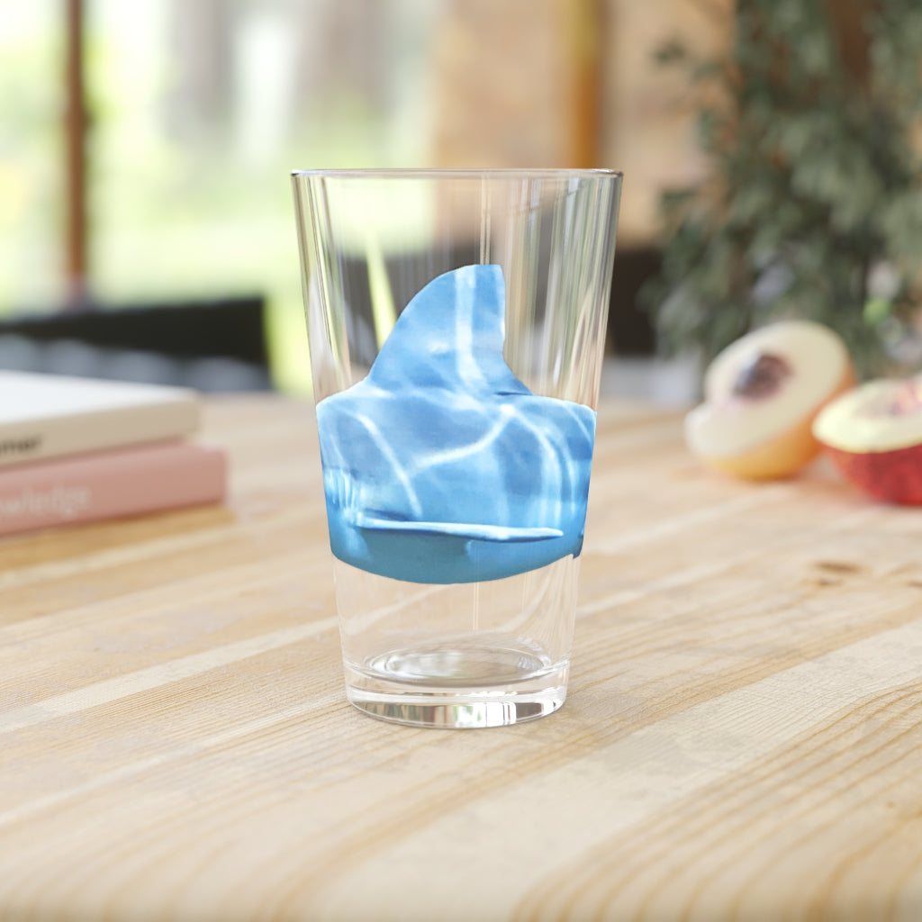 A clear 16oz Shark Pint Glass showcasing a customizable design, perfect for beverages.