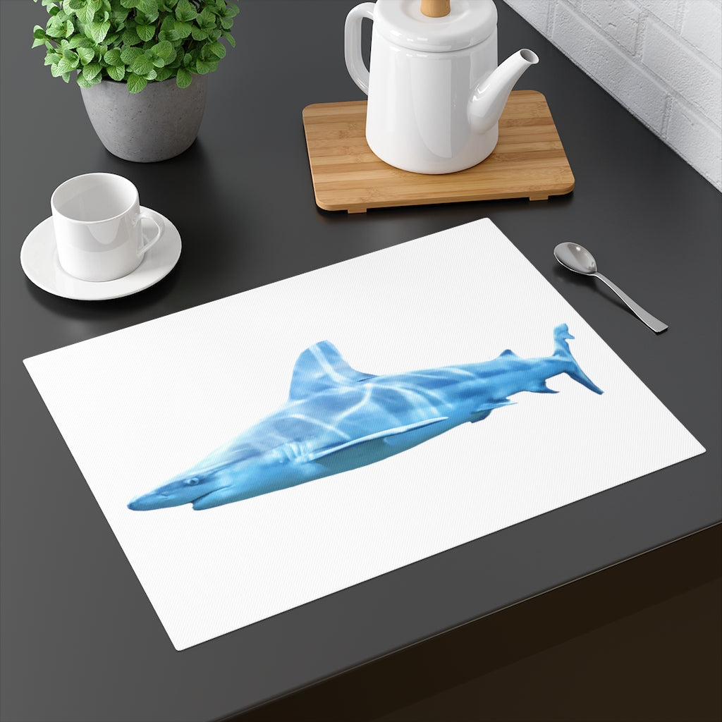 A colorful shark-themed placemat made of durable cotton, featuring a playful design on one side and a natural back.