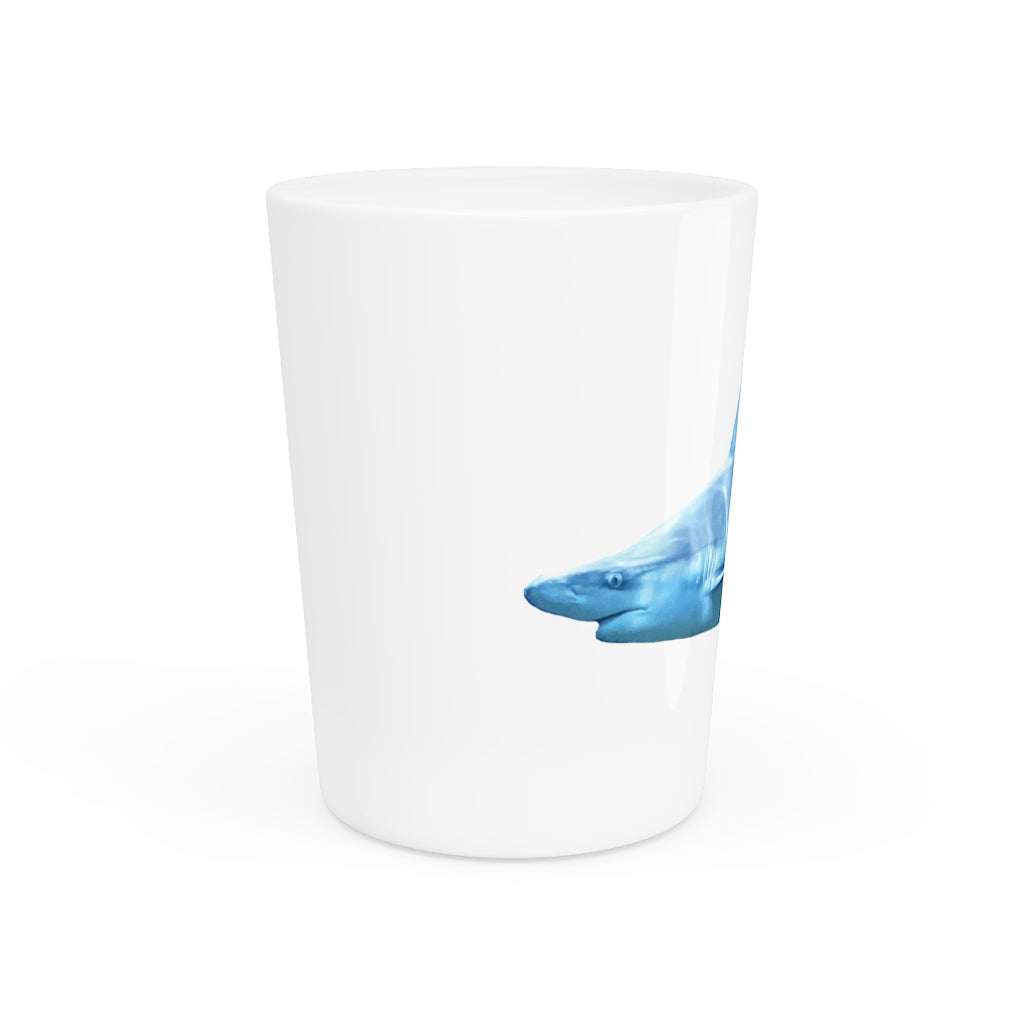 A personalized Shark Shot Glass made of white ceramic with a customizable design, featuring a black interior.