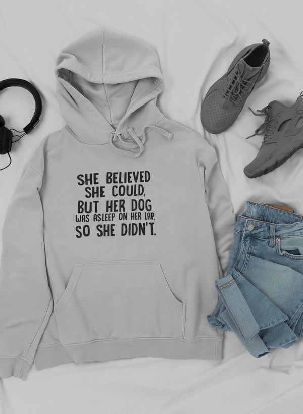 Cozy hoodie featuring the phrase 'She Believed She Could But Her Dog Was Asleep On Her Lap', designed for dog lovers.