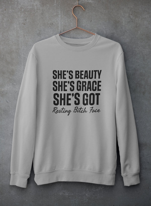 A stylish sweatshirt featuring the phrase 'She's Beauty She's Grace', made from a cozy cotton/poly fleece blend, perfect for casual wear.