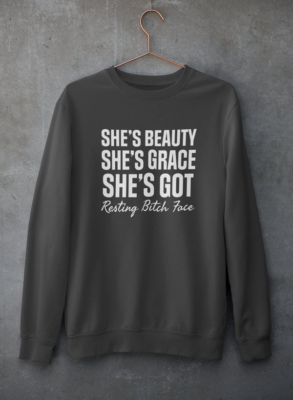 A stylish sweatshirt featuring the phrase 'She's Beauty She's Grace', made from a cozy cotton/poly fleece blend, perfect for casual wear.