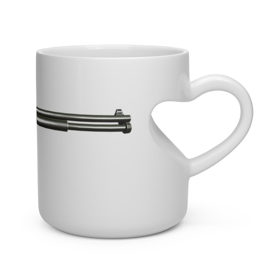 A white ceramic mug shaped like a heart with a heart-shaped handle, perfect for hot beverages.