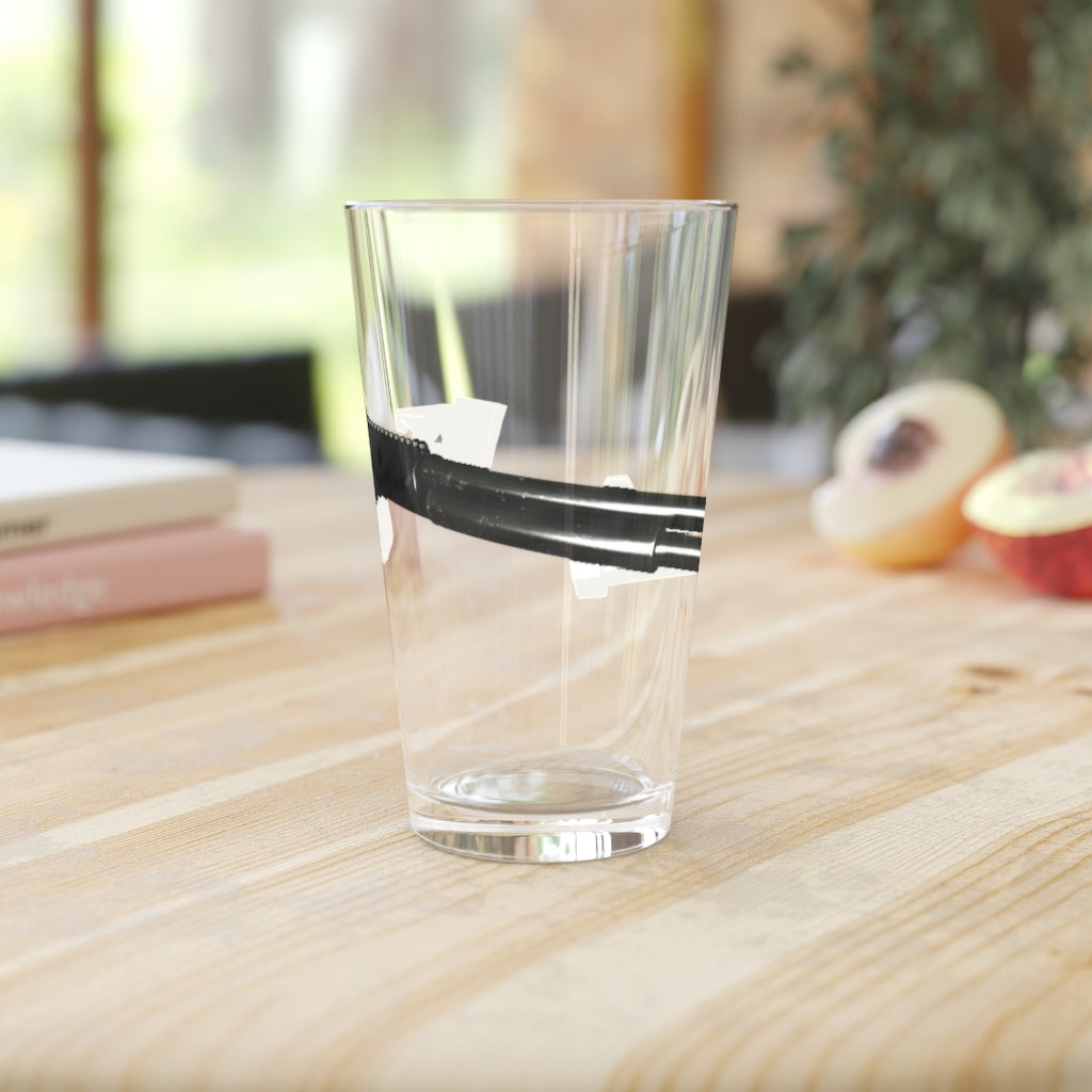 A clear 16oz Shotgun Pint Glass showcasing its sleek design and personalized printing options.