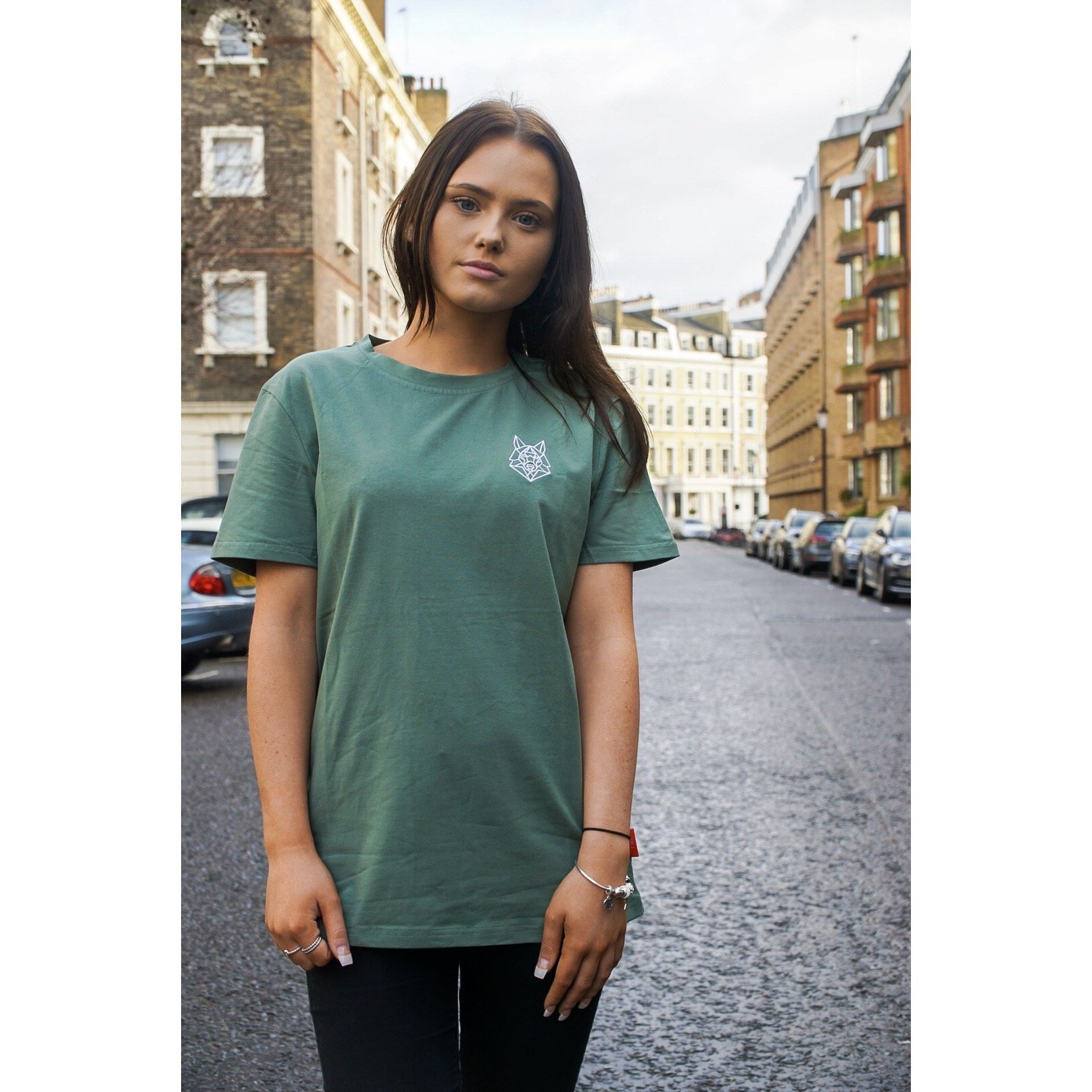 A fitted green T-shirt featuring a white embroidered Wolfe logo on the left chest, made from soft cotton and spandex.