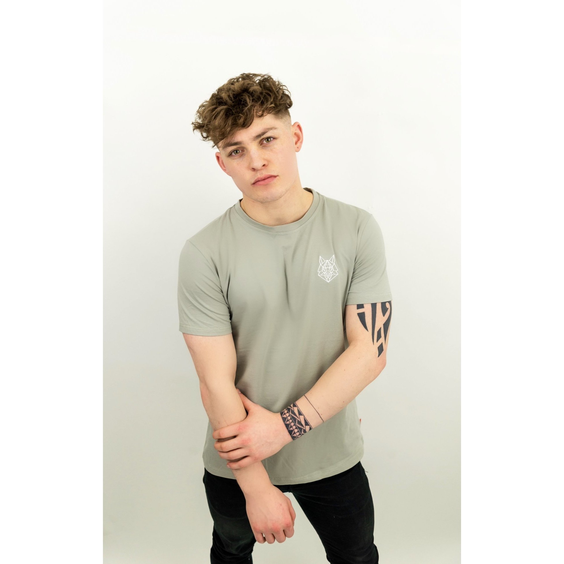 A fitted grey t-shirt featuring a white embroidered Wolfe logo on the left chest, made from a soft cotton and spandex blend.