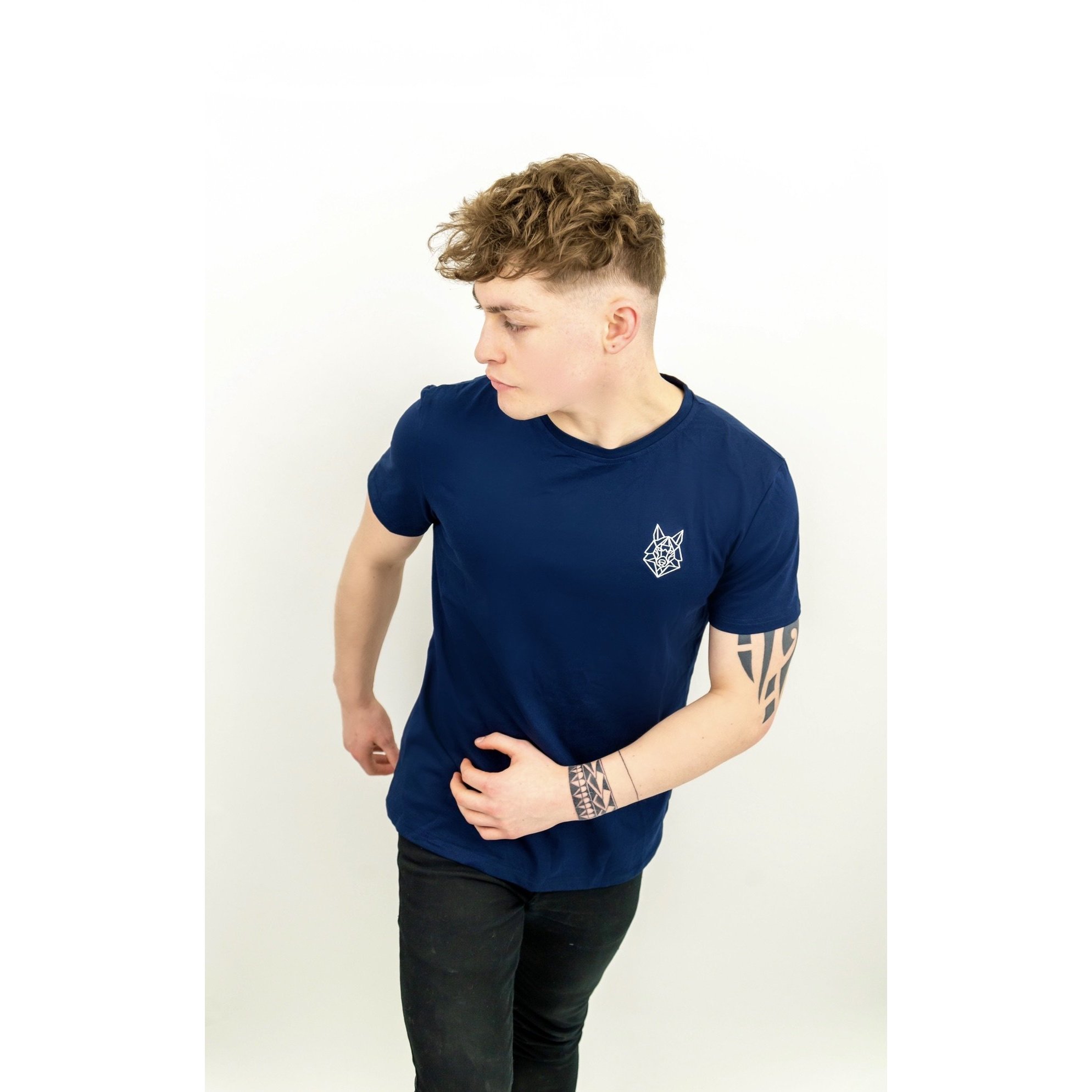 A fitted navy t-shirt featuring a white embroidered Wolfe logo on the left chest, made from a soft cotton and spandex blend.