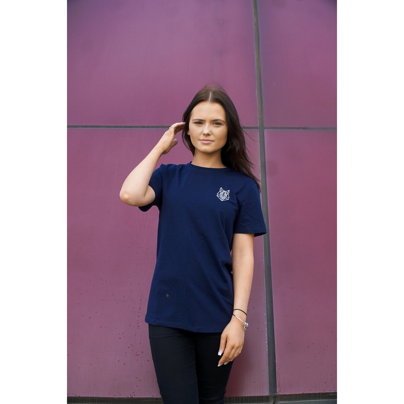 A fitted navy t-shirt featuring a white embroidered Wolfe logo on the left chest, made from a soft cotton and spandex blend.