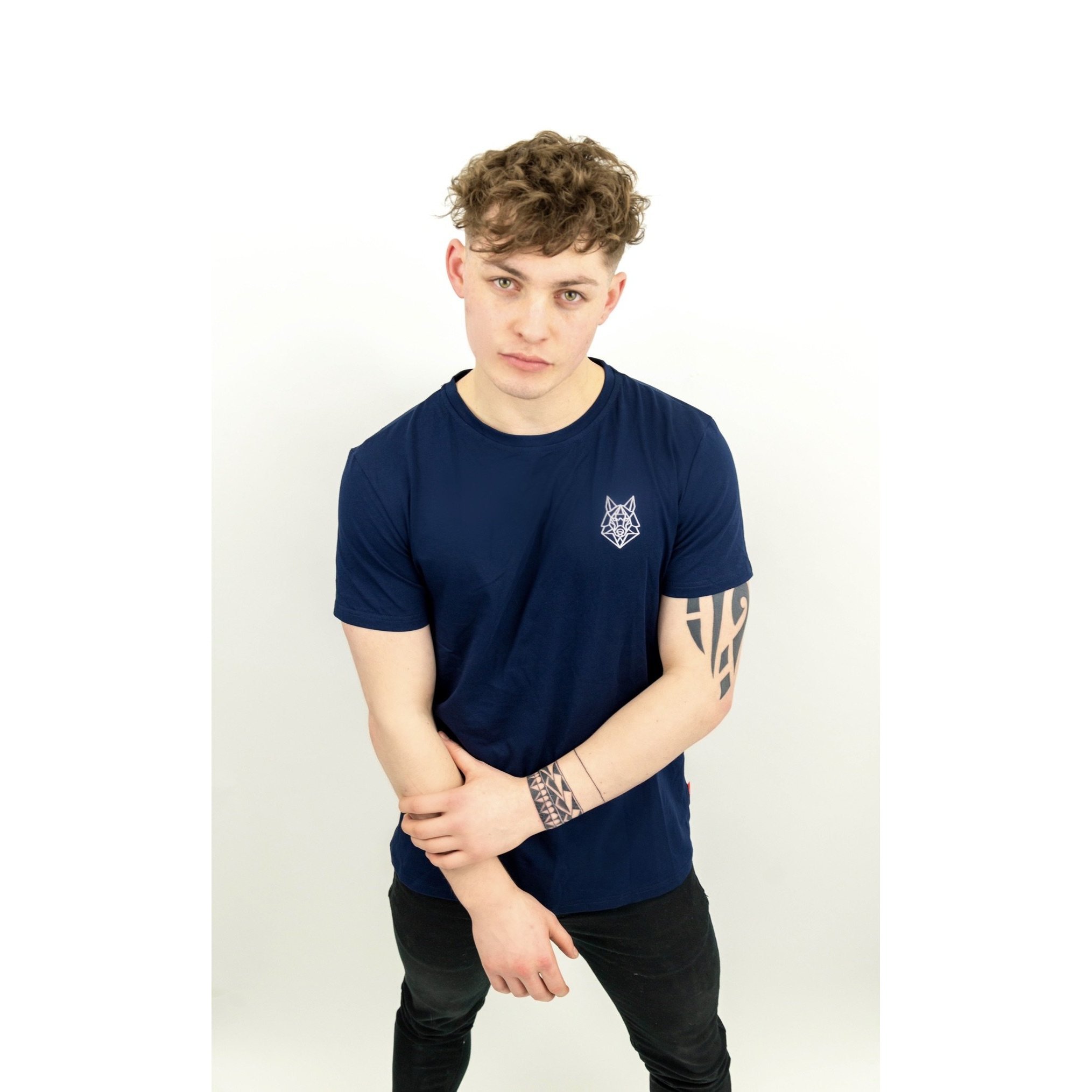 A fitted navy t-shirt featuring a white embroidered Wolfe logo on the left chest, made from a soft cotton and spandex blend.