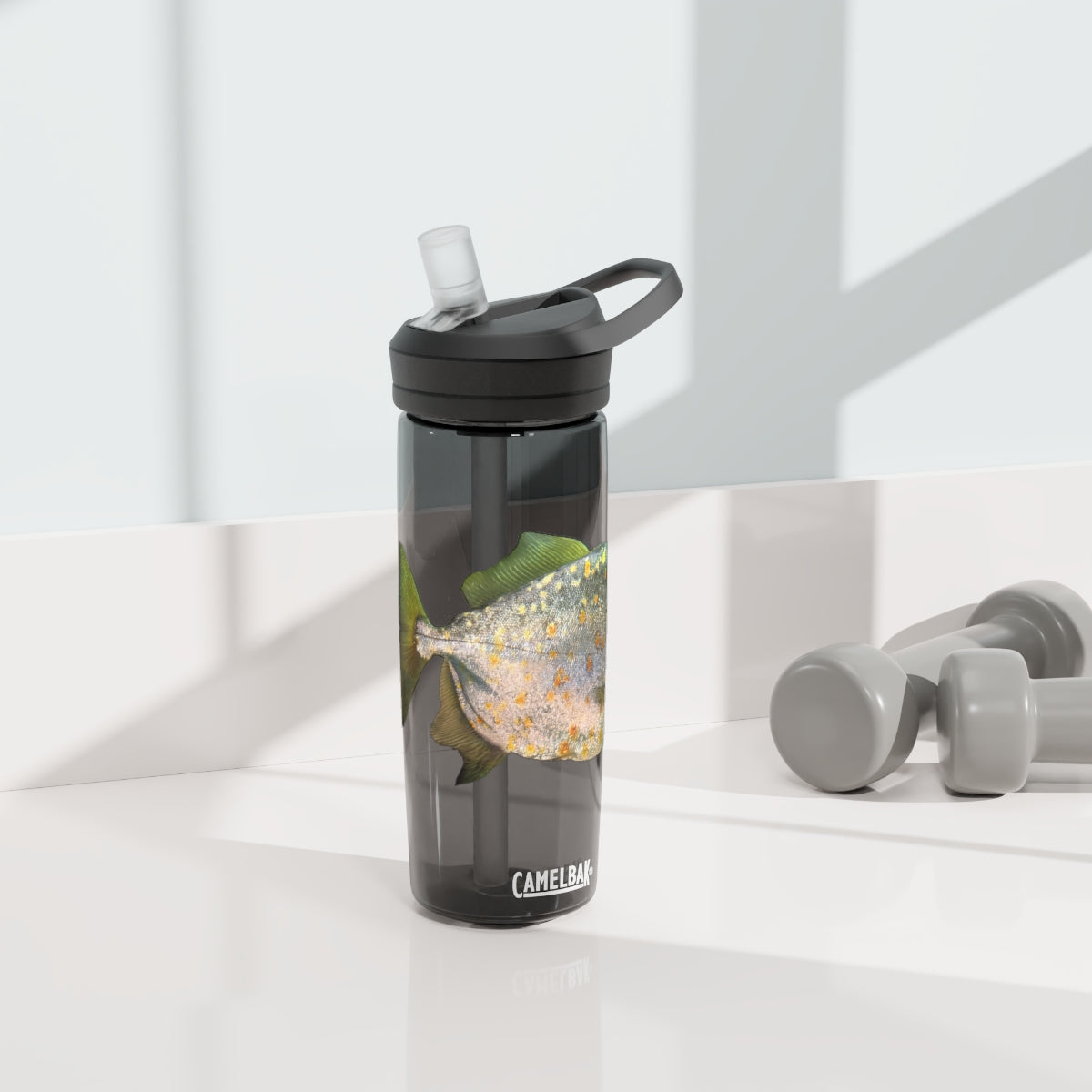 Silver and Spec Fish CamelBak Eddy® Water Bottle in 20oz and 25oz sizes, showcasing its durable Tritan™ material and spill-proof design.