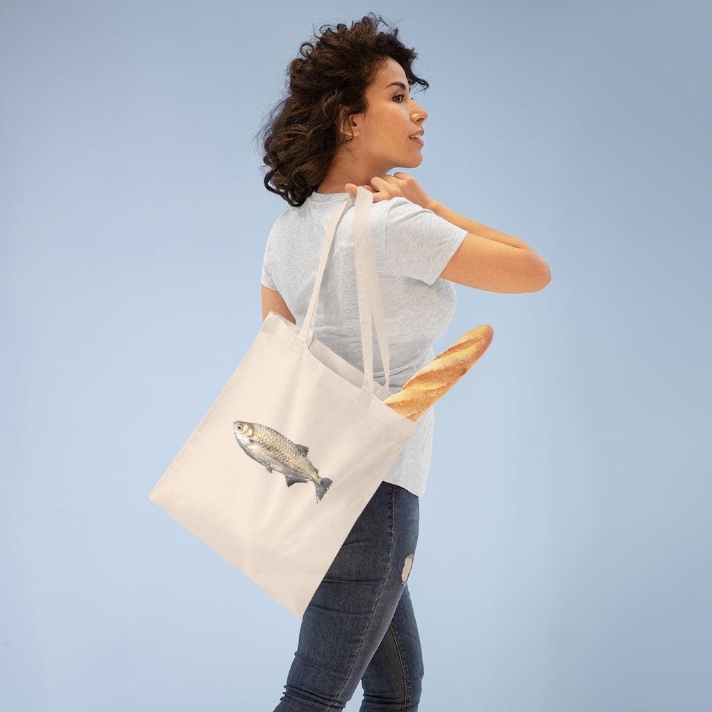 A stylish Silver Fish Tote Bag made of 100% cotton with long handles and cross stitching, available in multiple colors.