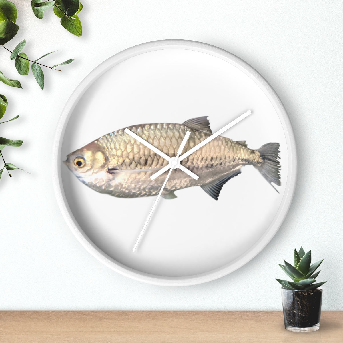 A stylish Silver Fish Wall Clock with a wooden frame and plexiglass face, featuring a unique fish design, perfect for indoor decor.