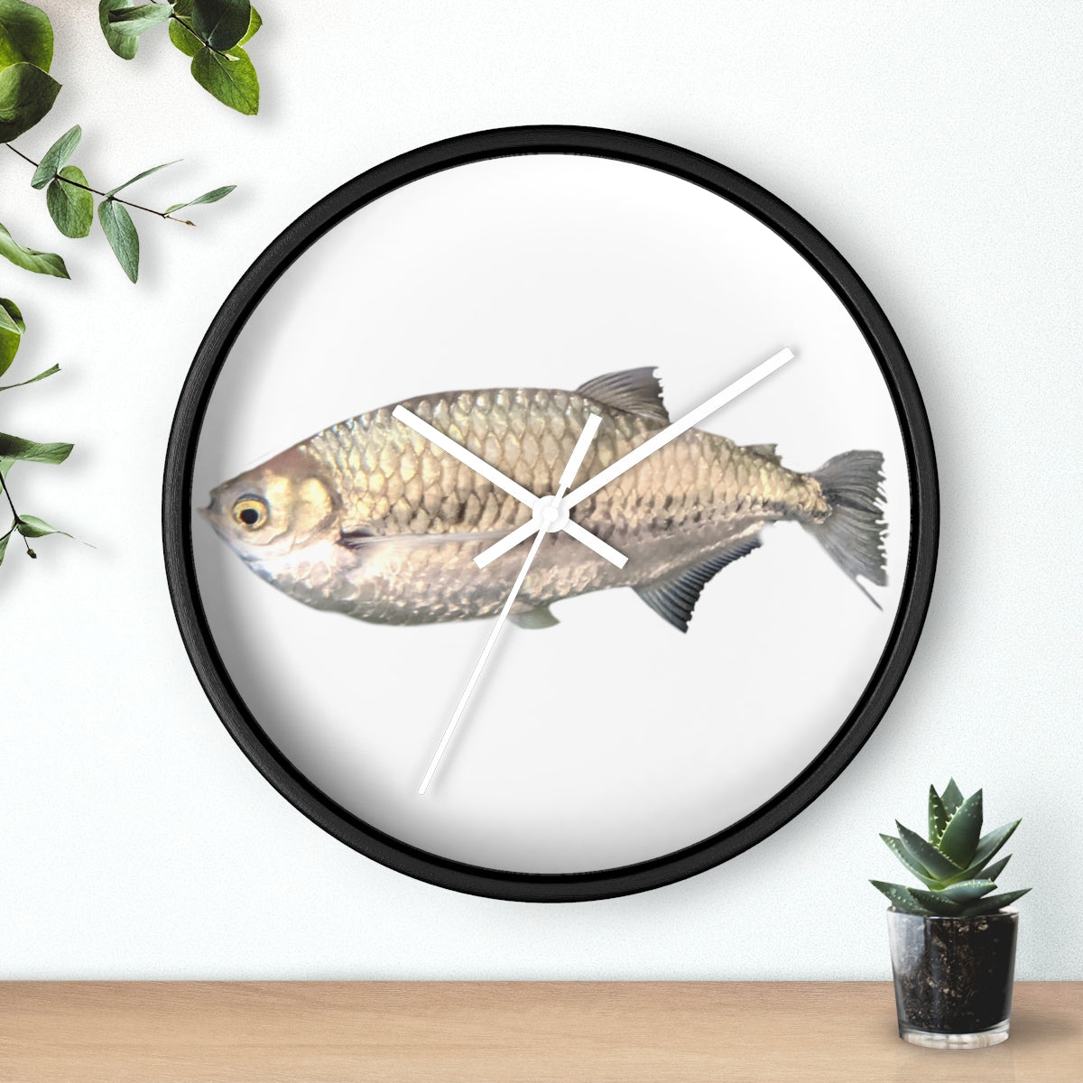 A stylish Silver Fish Wall Clock with a wooden frame and plexiglass face, featuring a unique fish design, perfect for indoor decor.