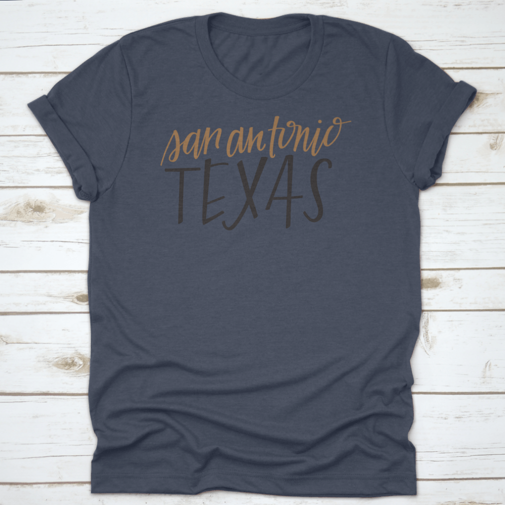 A stylish Simple Hand-Lettered Vector Of San Antonio Texas Shirt showcasing a unique design, made from high-quality cotton fabric.