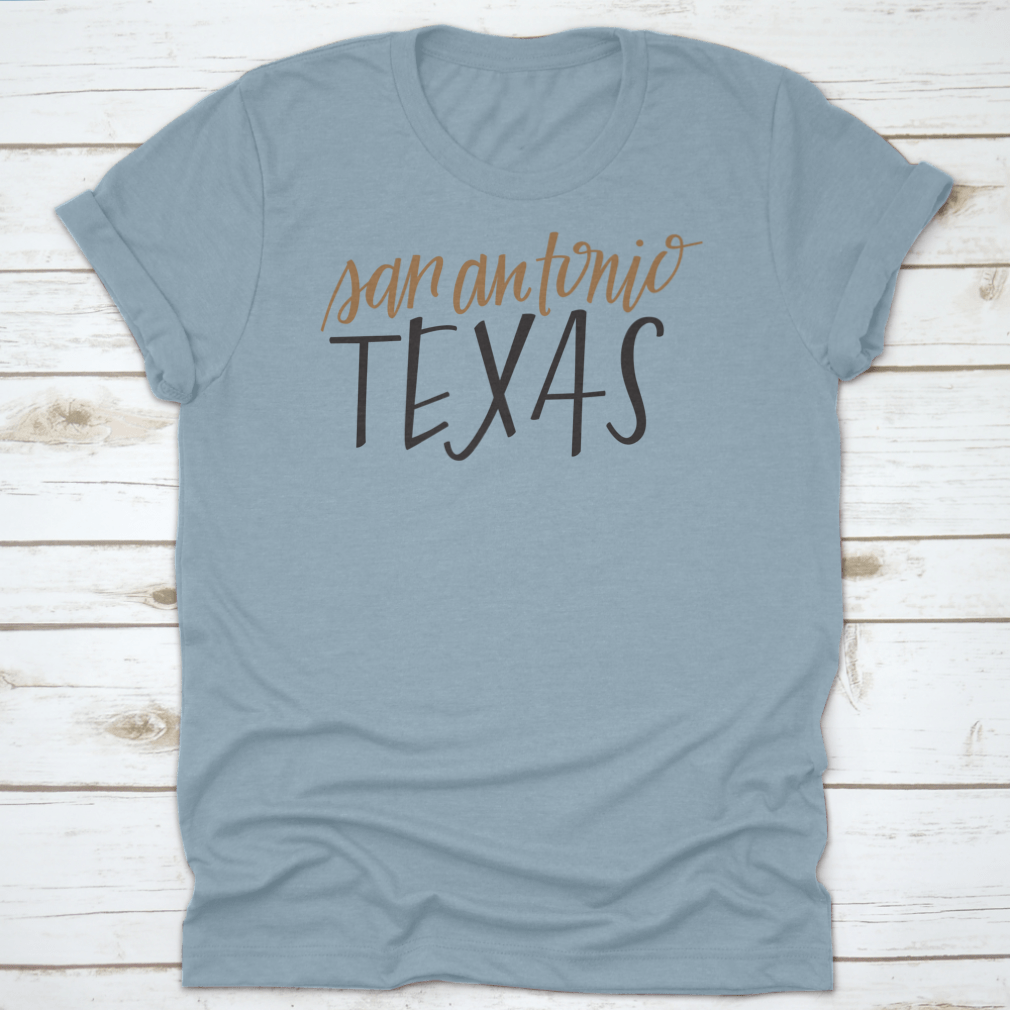 A stylish Simple Hand-Lettered Vector Of San Antonio Texas Shirt showcasing a unique design, made from high-quality cotton fabric.