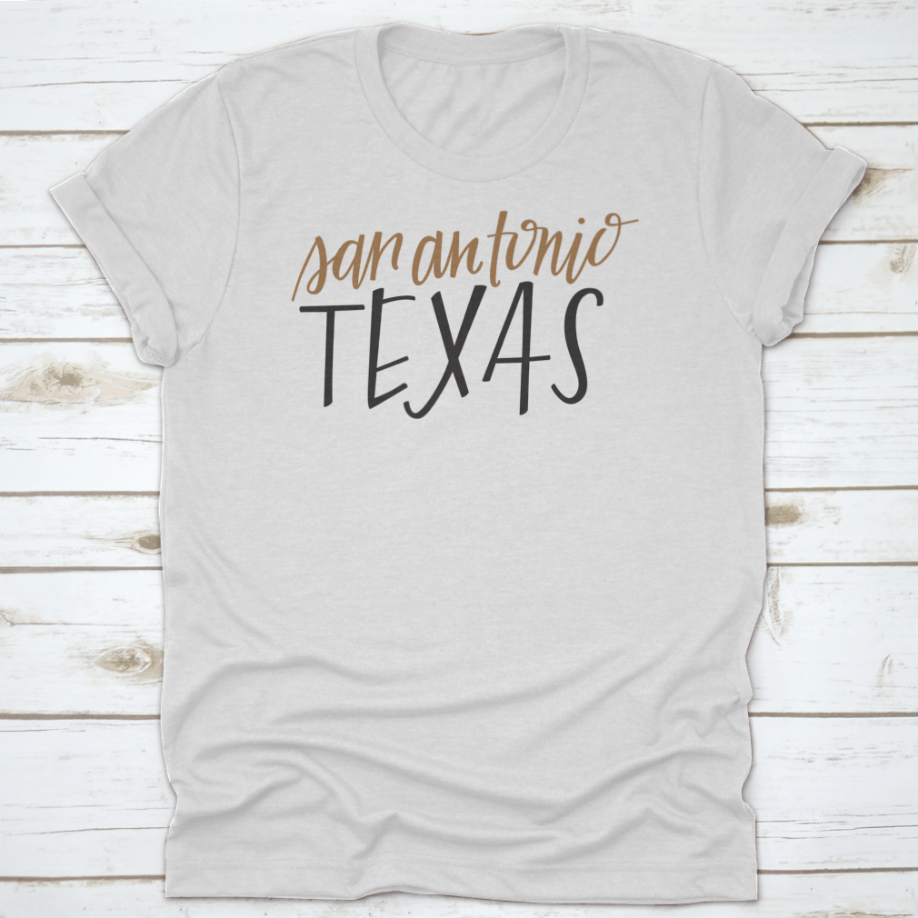 A stylish Simple Hand-Lettered Vector Of San Antonio Texas Shirt showcasing a unique design, made from high-quality cotton fabric.