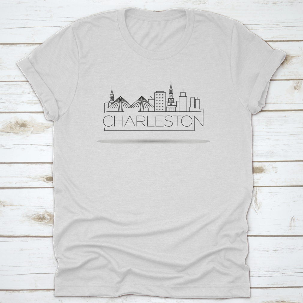 A stylish Simple Minimal Charleston T-shirt featuring a linear city skyline design in a typographic style, made from soft cotton fabric.