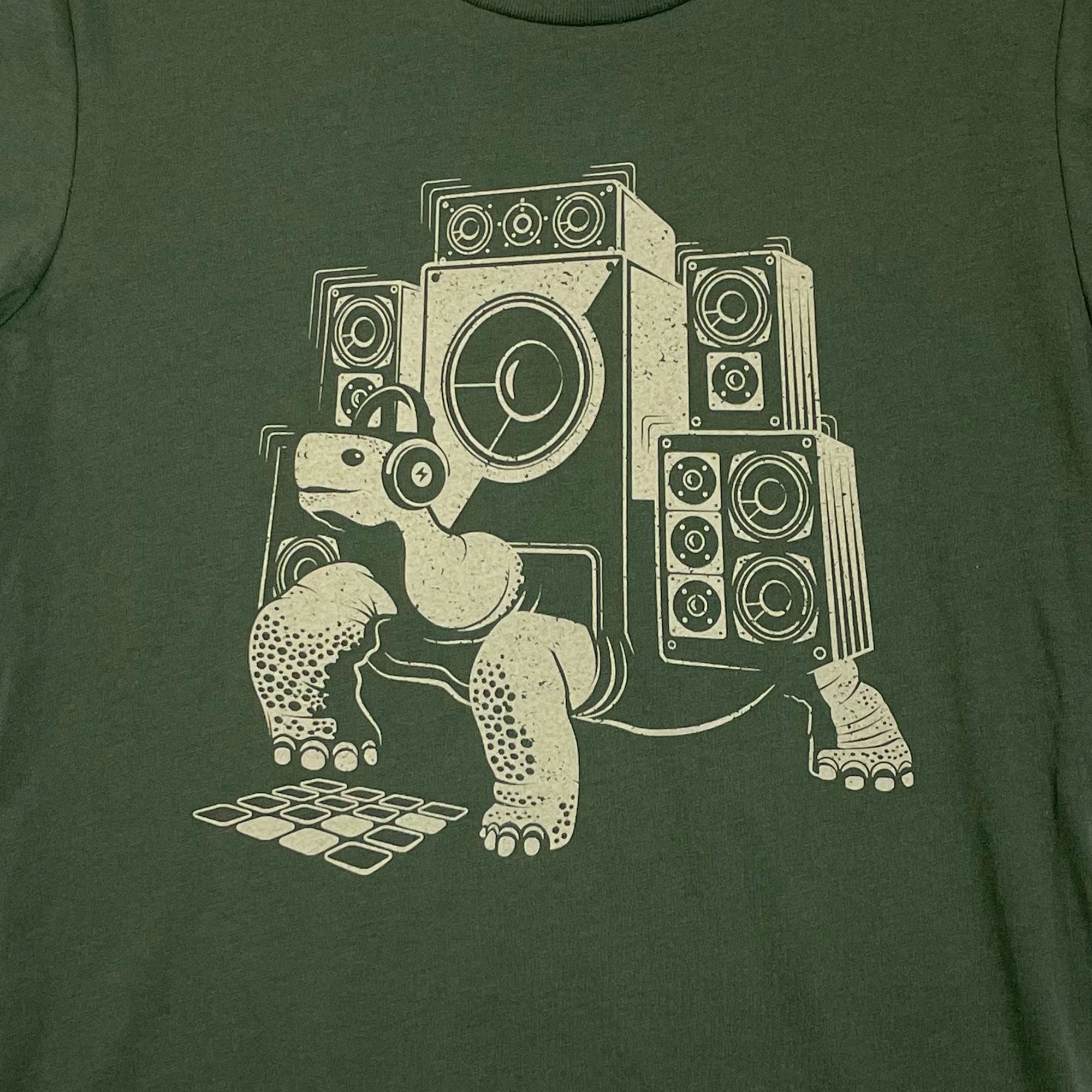 Olive green Slow Beats Women's T-shirt featuring a musical tortoise design, perfect for artists and tech enthusiasts.