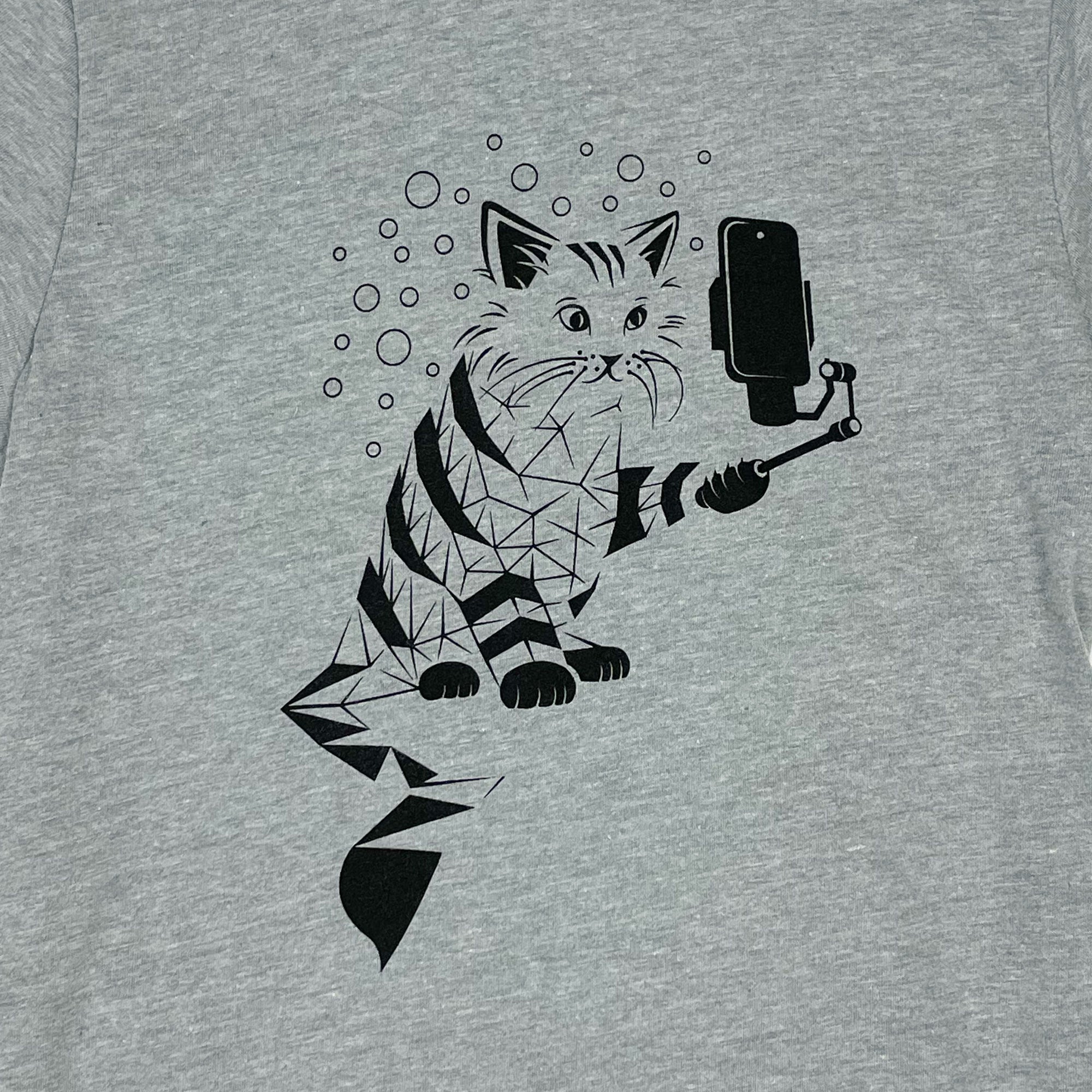 Snap Cat Kids T-Shirt featuring a playful Cheshire Cat illustration on a heather grey fitted crew neck design.