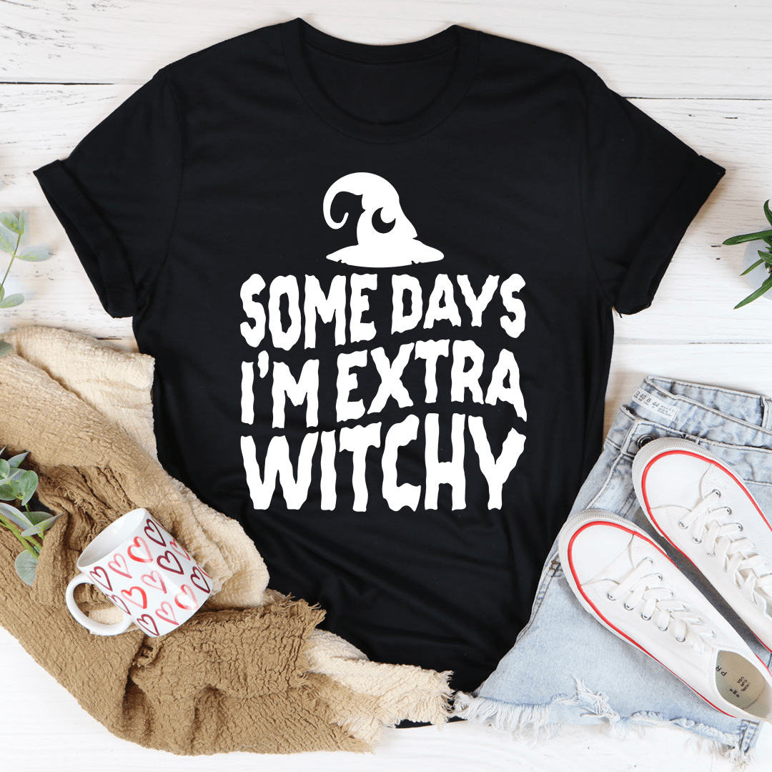 A stylish black t-shirt with the phrase 'Some Days I'm Extra Witchy' printed in a whimsical font, showcasing its soft fabric and durable stitching.