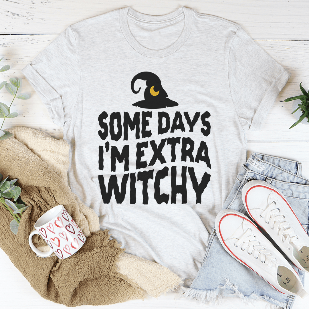 A stylish black t-shirt with the phrase 'Some Days I'm Extra Witchy' printed in a whimsical font, showcasing its soft fabric and durable stitching.