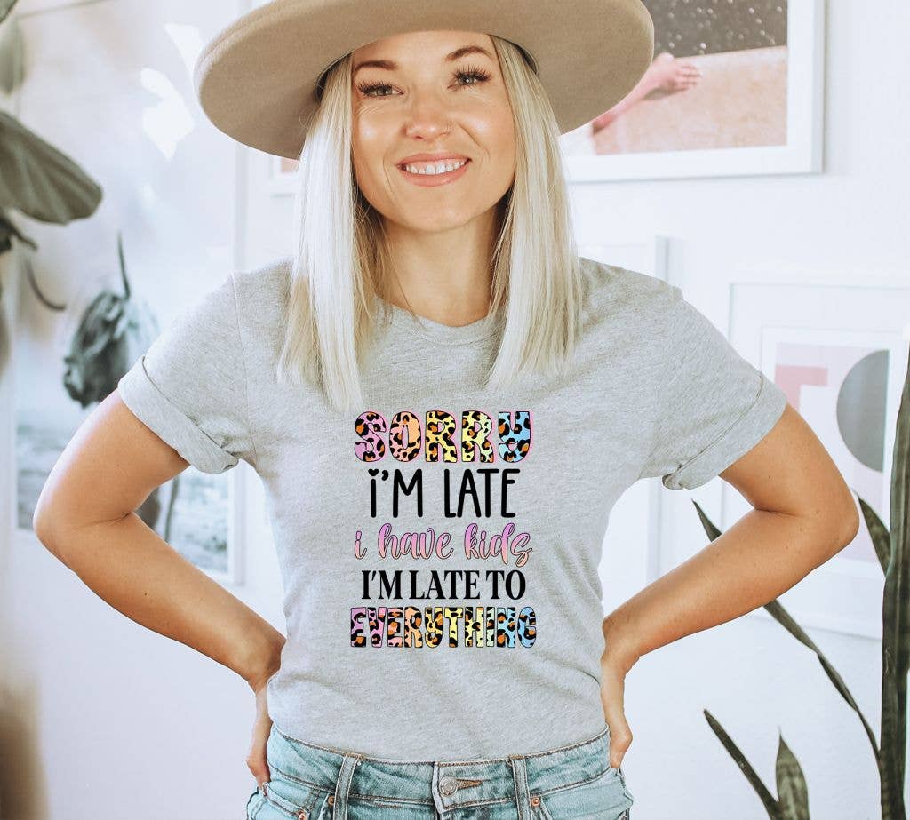 A humorous T-shirt featuring the phrase 'Sorry I Am Late I Have Kids I Am Late To Everything', made from soft ring spun cotton.