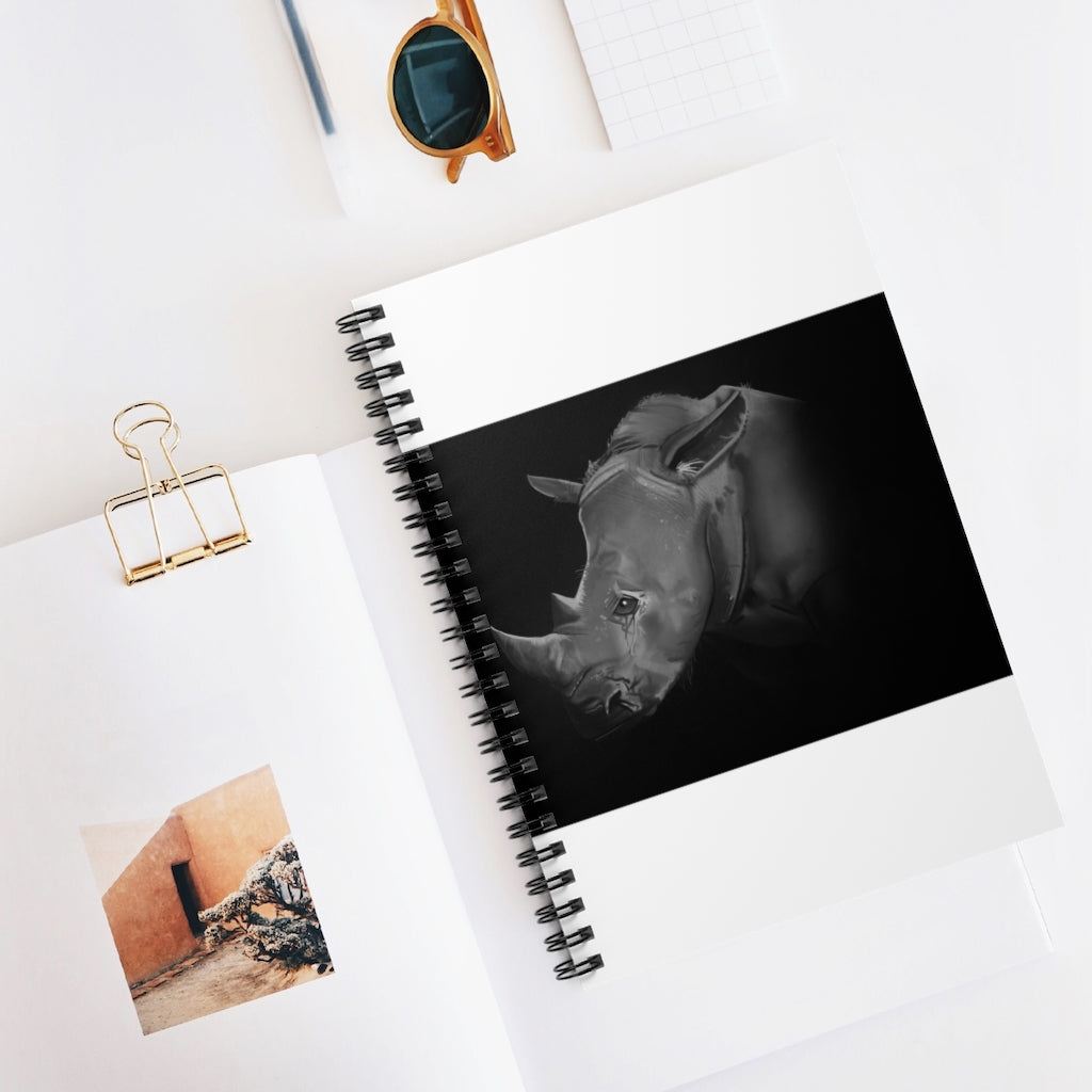 A stylish spiral notebook with ruled line pages, featuring a printed front cover and a black back cover, ideal for notes and lists.