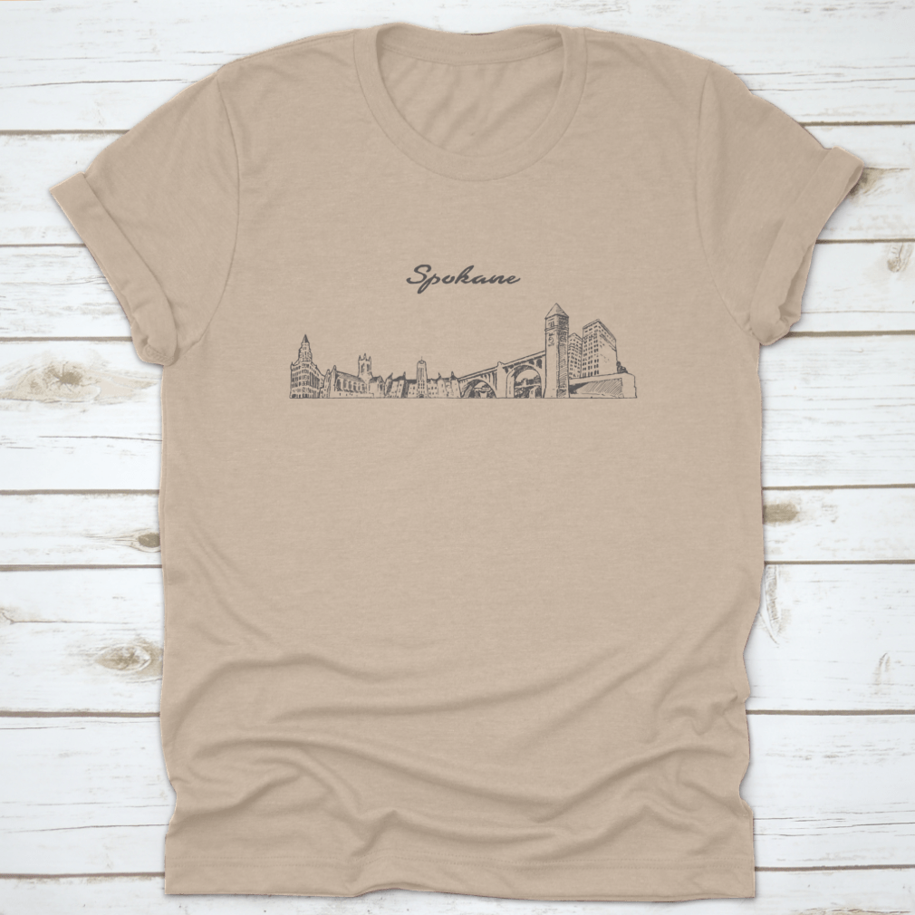 Hand-drawn vector design of Spokane skyline on a comfortable cotton t-shirt, showcasing the city's iconic buildings.