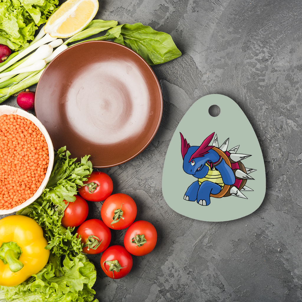 Squirtois Sublimation Glass Cutting Board in water droplet shape, featuring a toughened glass surface and four rubber feet for stability.