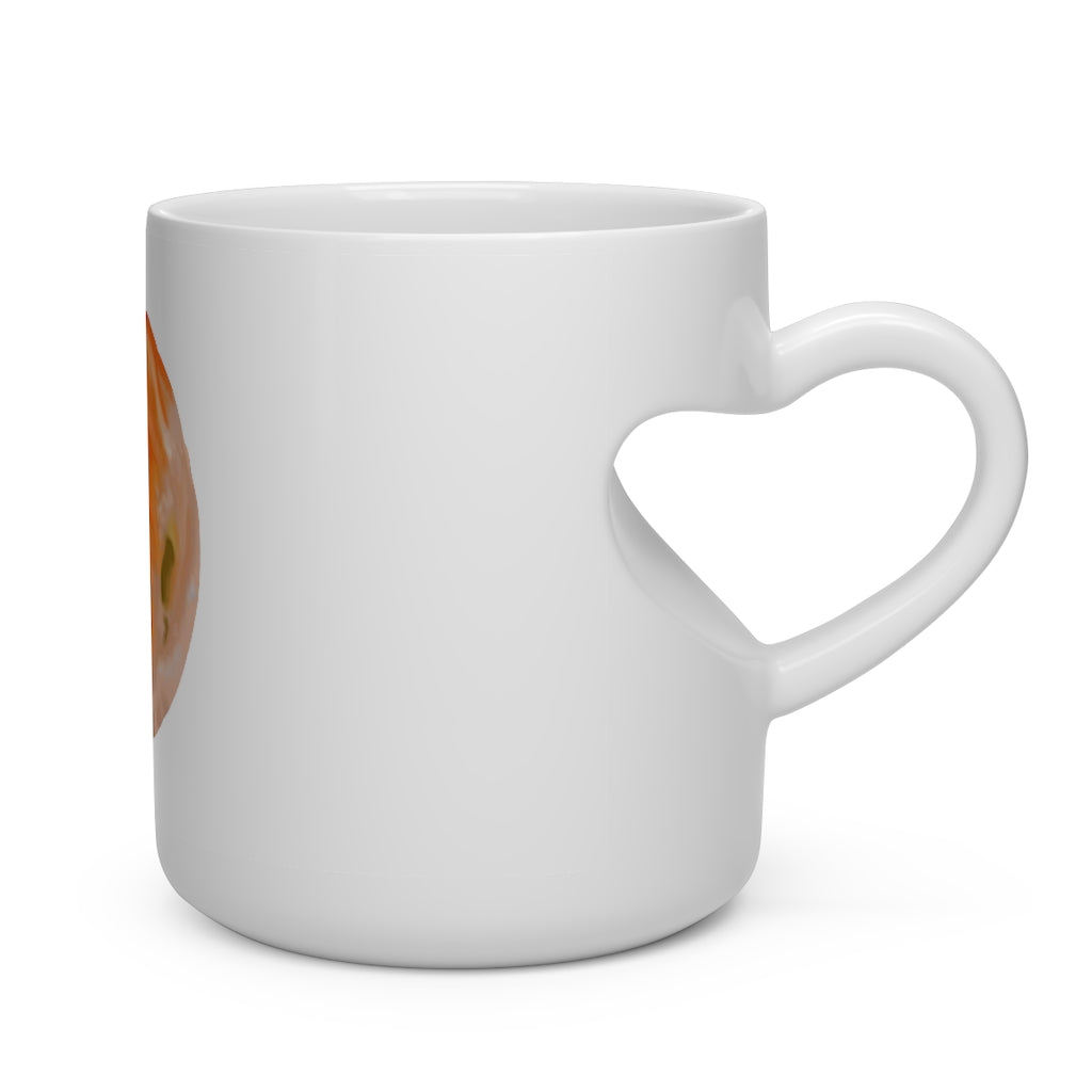 A white ceramic mug shaped like a heart with a heart-shaped handle, perfect for hot beverages.